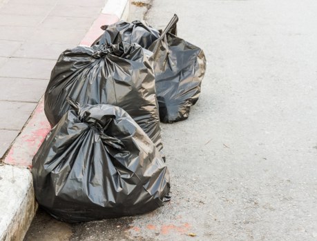 Construction workers managing waste at a Southwark site