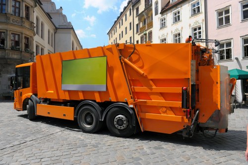Electric low-emission van loading recyclable materials